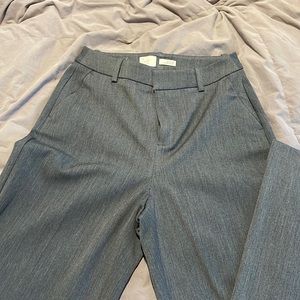 Grey dress pants, never worn, still pressed and ready to wear.